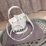 Side profile of everyday-luxe sleek women's handbag – women's designer-style accessory