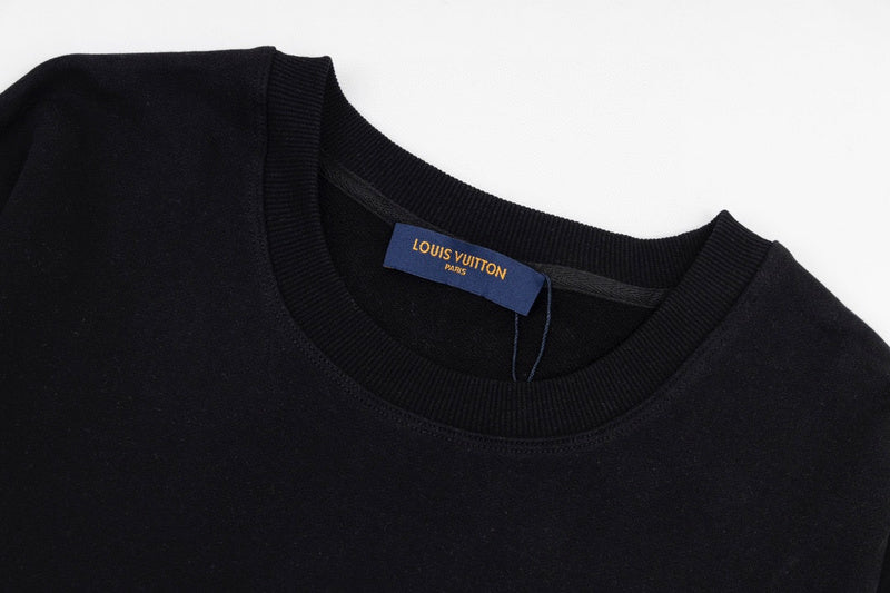 Flat lay presentation of Louis Vuitton luxury clothing with label-forward styling