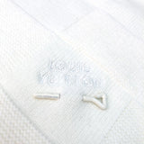 Full styled look of Louis Vuitton luxury clothing with monogram-inspired silhouette