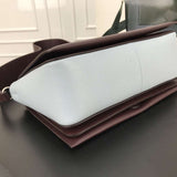Styled lifestyle shot of signature structured women's handbag – women's everyday handbag