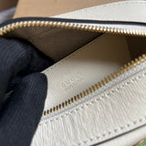 Side profile of elevated chic women's handbag – women's luxury accessory