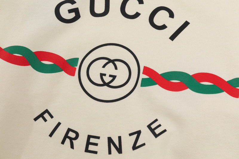 Flat lay presentation of Gucci luxury clothing with tailored silhouette