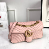 Side profile of polished signature women's handbag – women's statement bag