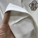 Side profile of Louis Vuitton luxury clothing with logo-detail design