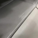 Side profile of modern refined women's handbag – women's luxury accessory
