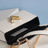 Side profile of refined modern women's handbag – women's luxury accessory