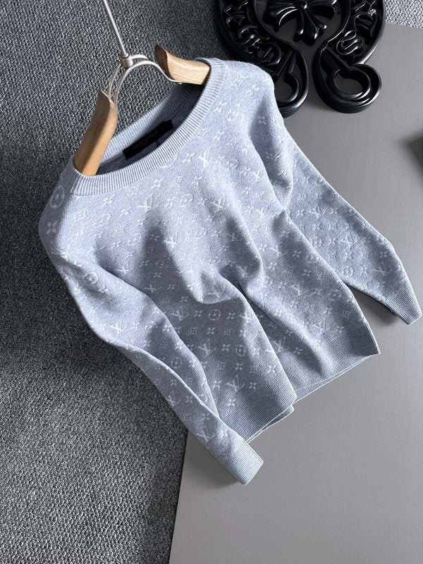 Close-up detail shot of Louis Vuitton luxury clothing with label-forward styling