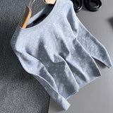Close-up detail shot of Louis Vuitton luxury clothing with label-forward styling