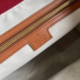 Side profile of classic signature women's handbag – women's designer-style accessory