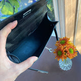 Close-up detail of poised bag design