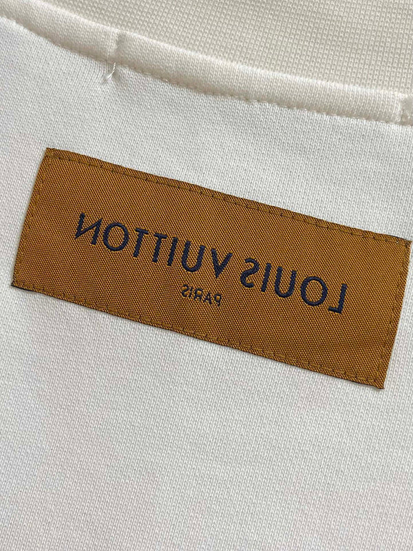 Side profile of Louis Vuitton luxury clothing with tailored silhouette