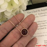 Lifestyle view of Van Cleef & Arpels unisex jewelry piece