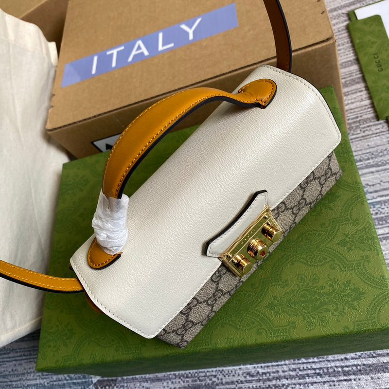Styled lifestyle shot of structured everyday-luxe women's handbag – women's statement bag