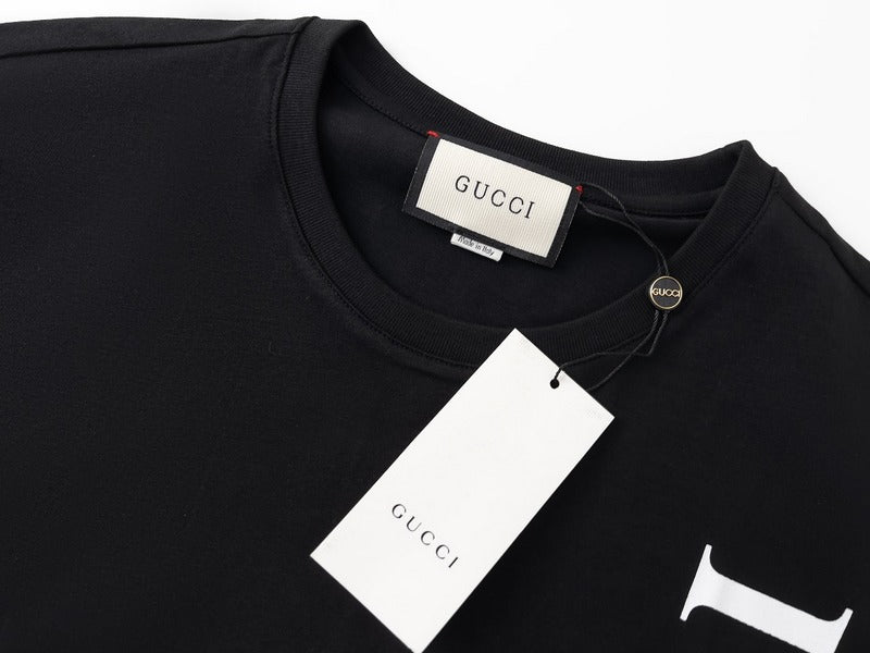 Flat lay presentation of Gucci luxury clothing with runway-inspired design