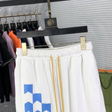 Close-up detail shot of Rhude luxury clothing with logo-detail design