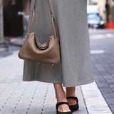  curated top-handle bag styled with outfit