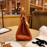 Side view of refined structured handbag