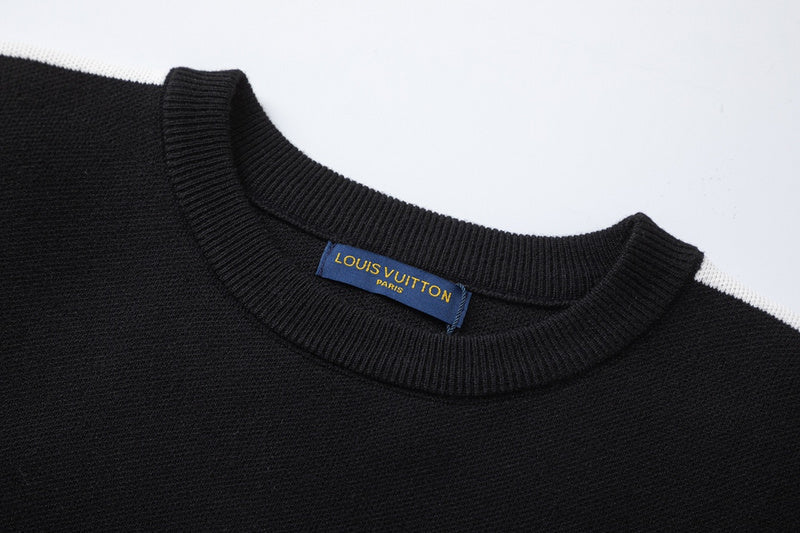 Close-up detail shot of Louis Vuitton luxury clothing with label-forward styling