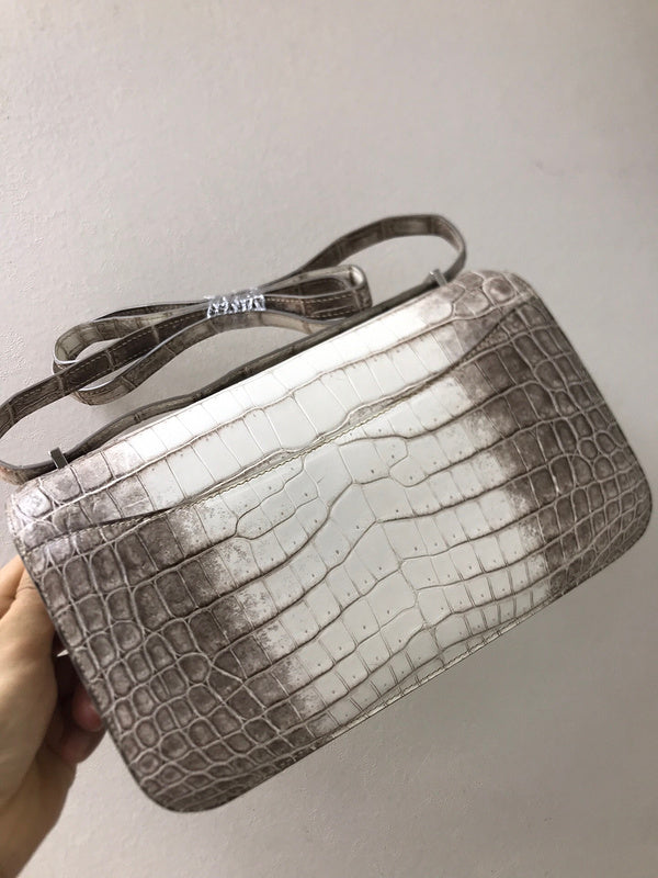 Side view of sculpted structured handbag