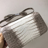 Side view of sculpted structured handbag