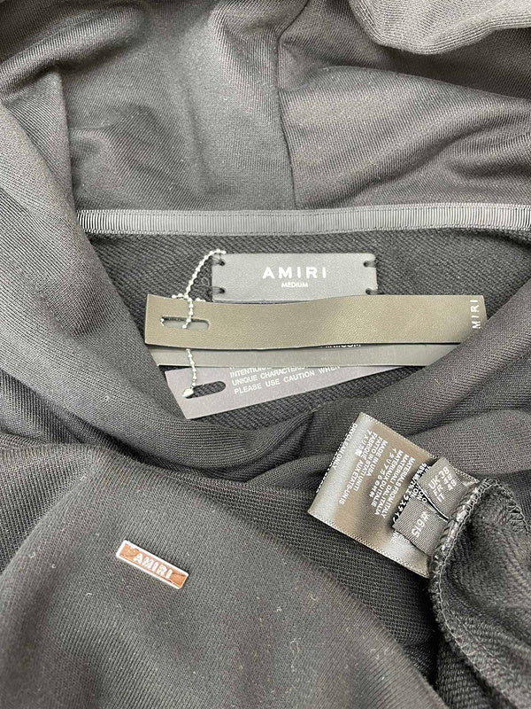 Three-quarter angle view of Amiri luxury piece style No.089