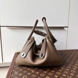  graceful top-handle bag styled with outfit 18