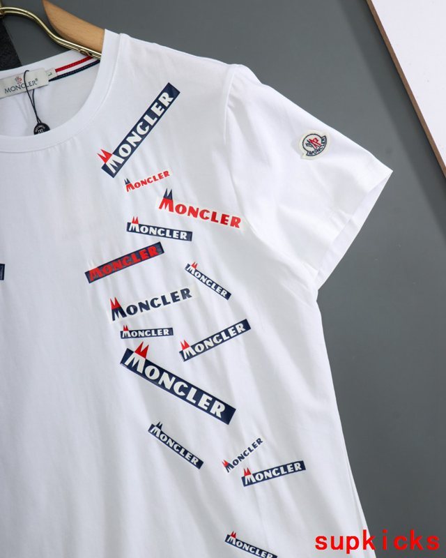Flat lay presentation of Moncler luxury clothing with tailored silhouette