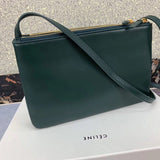 Styled lifestyle shot of structured classic women's handbag – women's premium purse