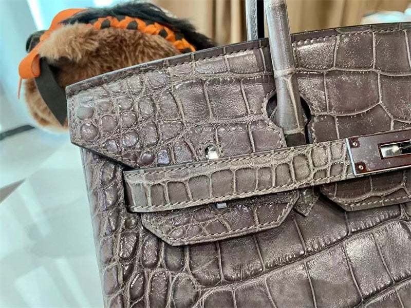 Side view of classic structured handbag