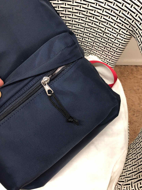 Styled lifestyle shot of classic refined women's handbag – women's luxury handbag