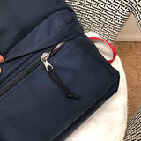 Styled lifestyle shot of classic refined women's handbag – women's luxury handbag