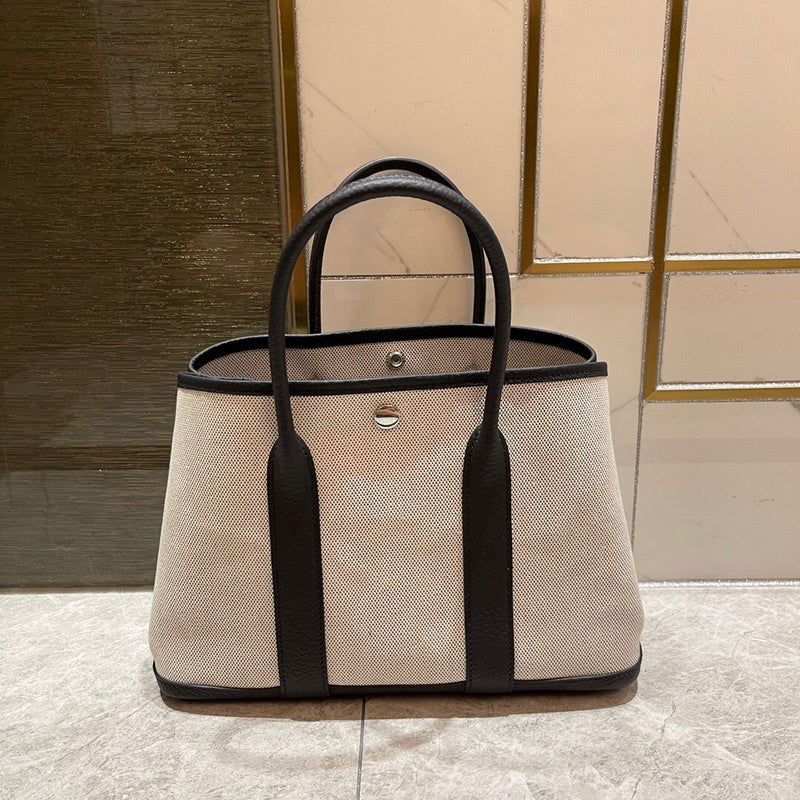 Side view of refined structured handbag