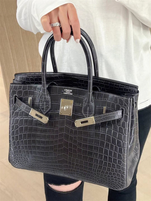 Side view of considered structured handbag