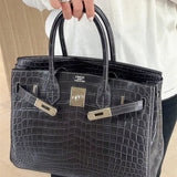 Side view of considered structured handbag