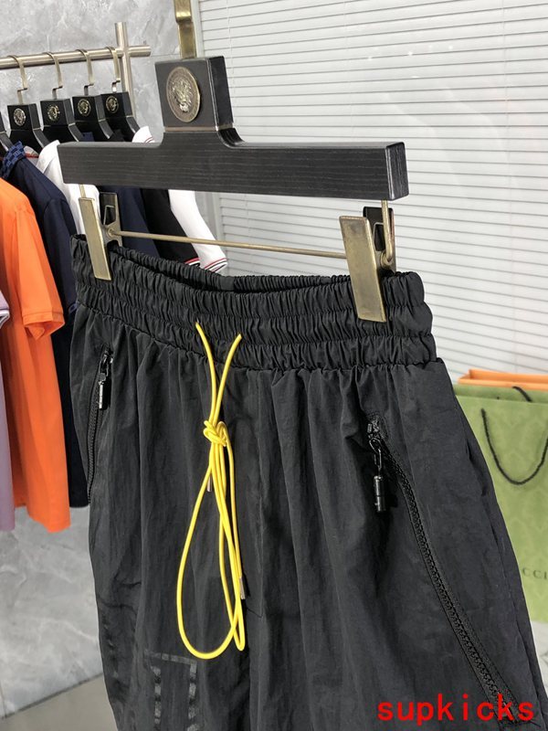 Flat lay presentation of Rhude luxury clothing with runway-inspired design