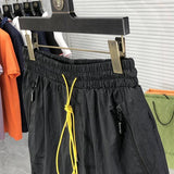 Flat lay presentation of Rhude luxury clothing with runway-inspired design