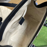 Side profile of sleek refined women's handbag – women's luxury accessory