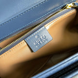 Side profile of refined polished women's handbag – women's luxury accessory
