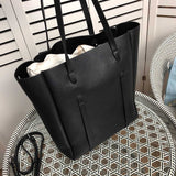 Handle and strap detail of polished chic women's handbag – women's designer-style accessory