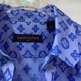 Close-up detail shot of Louis Vuitton luxury clothing with signature branding