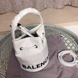 Styled lifestyle shot of everyday-luxe sleek women's handbag – women's designer-style accessory