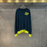 Close-up detail shot of Louis Vuitton luxury clothing with label-forward styling