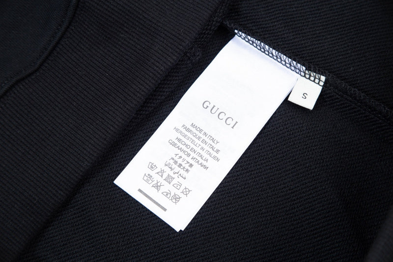 Close-up detail shot of Gucci luxury clothing with contemporary cut
