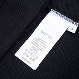 Close-up detail shot of Gucci luxury clothing with contemporary cut
