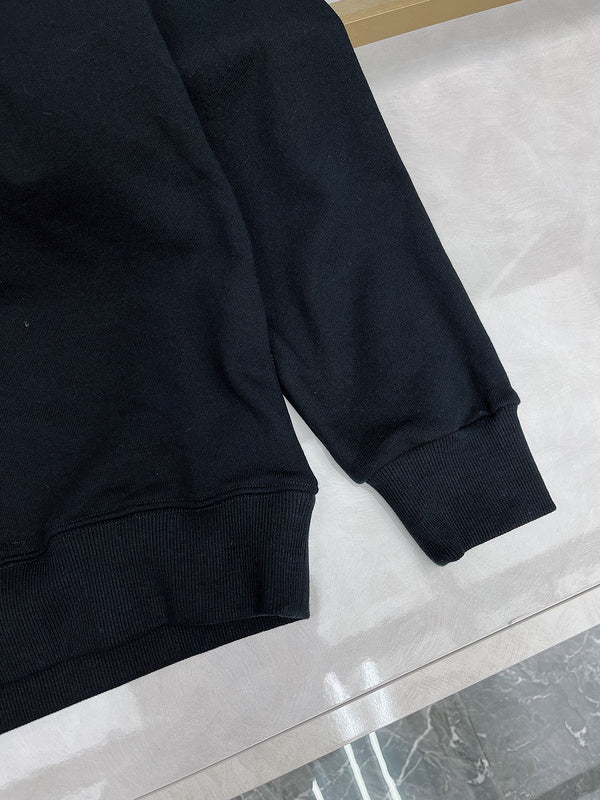 Flat lay presentation of Gucci luxury clothing with monogram-inspired silhouette