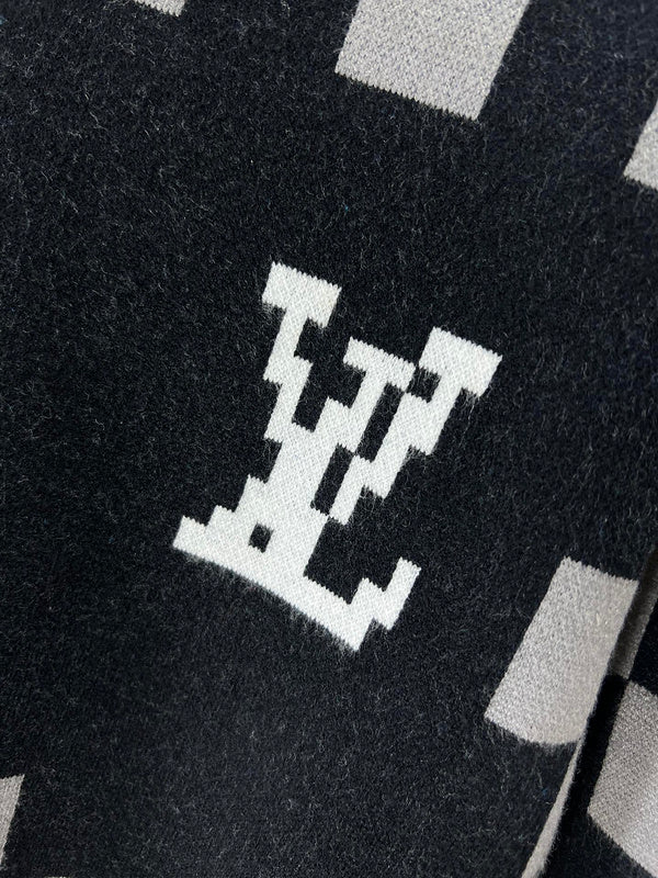 Flat lay presentation of Louis Vuitton luxury clothing with logo-detail design