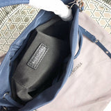 Side profile of statement sleek women's handbag – women's statement bag