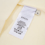 Close-up detail shot of Gucci luxury clothing with contemporary cut