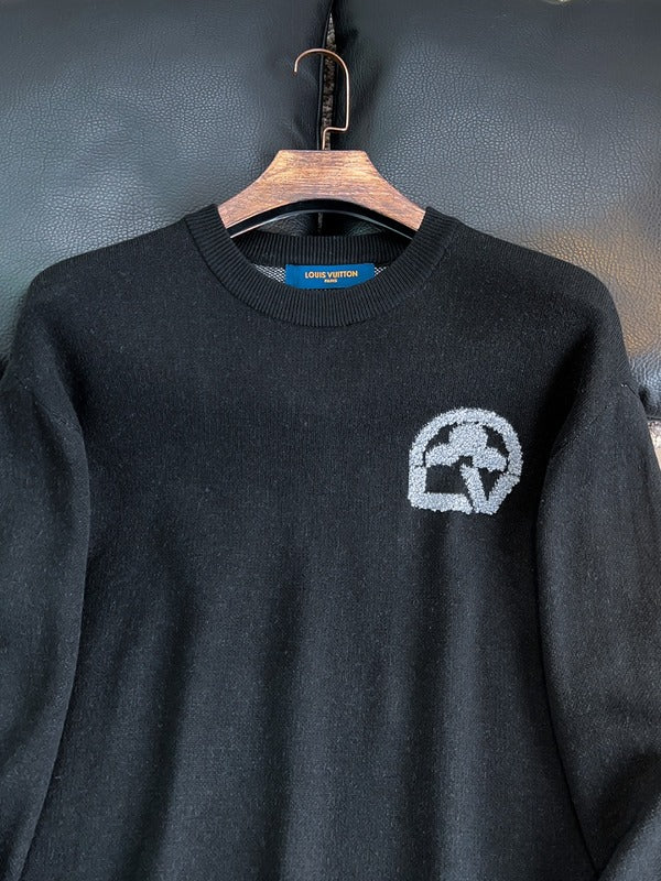 Full styled look of Louis Vuitton luxury clothing with monogram-inspired silhouette