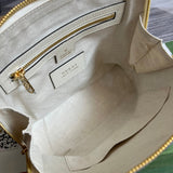 Side profile of signature elevated women's handbag – women's statement bag